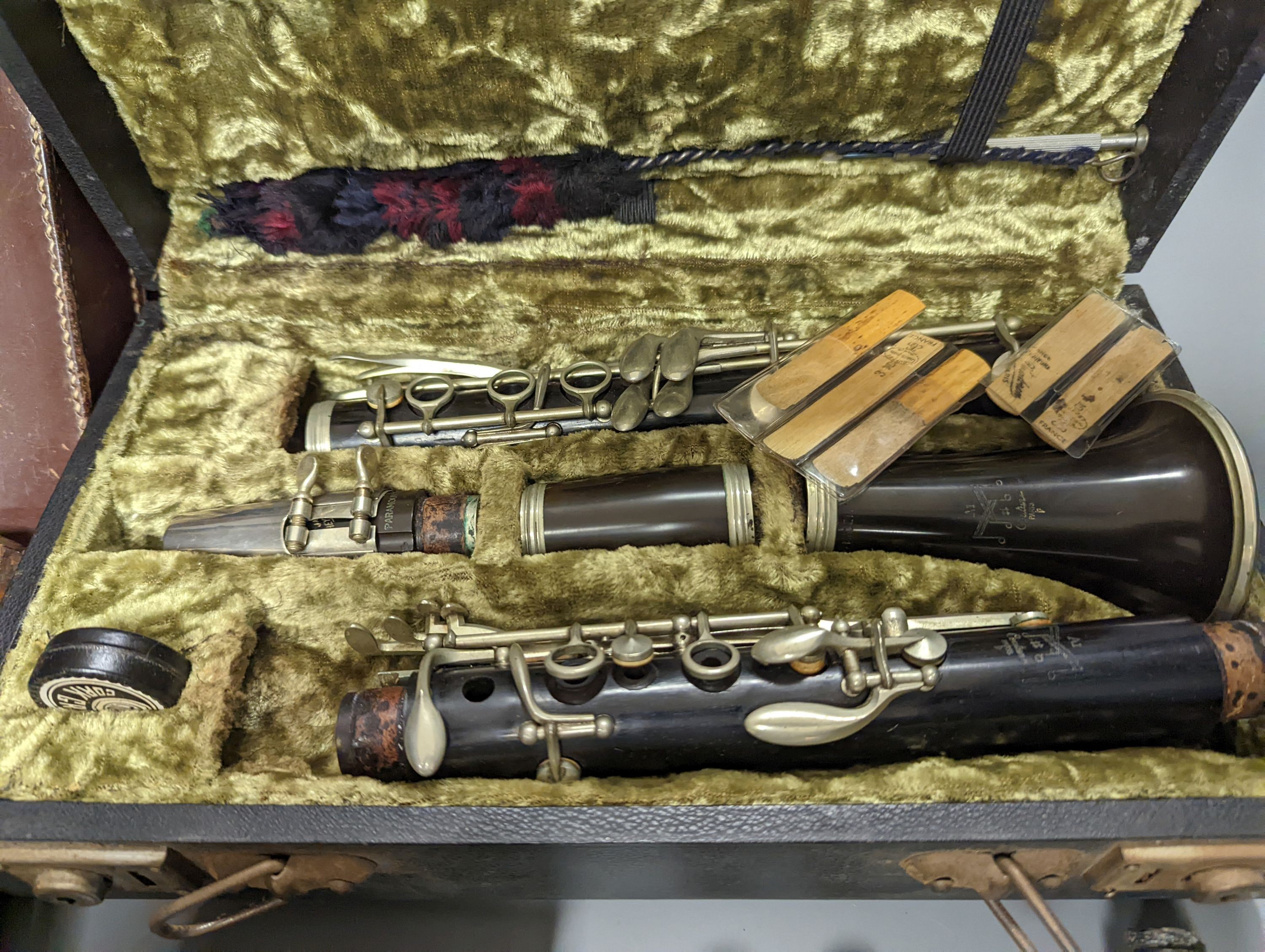 Three ebony or rosewood flutes and a clarinet